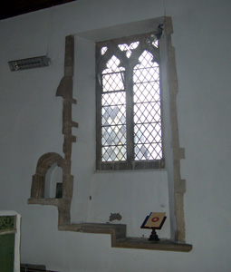 South wall of the chancel showing piscina and sedilia March 2011